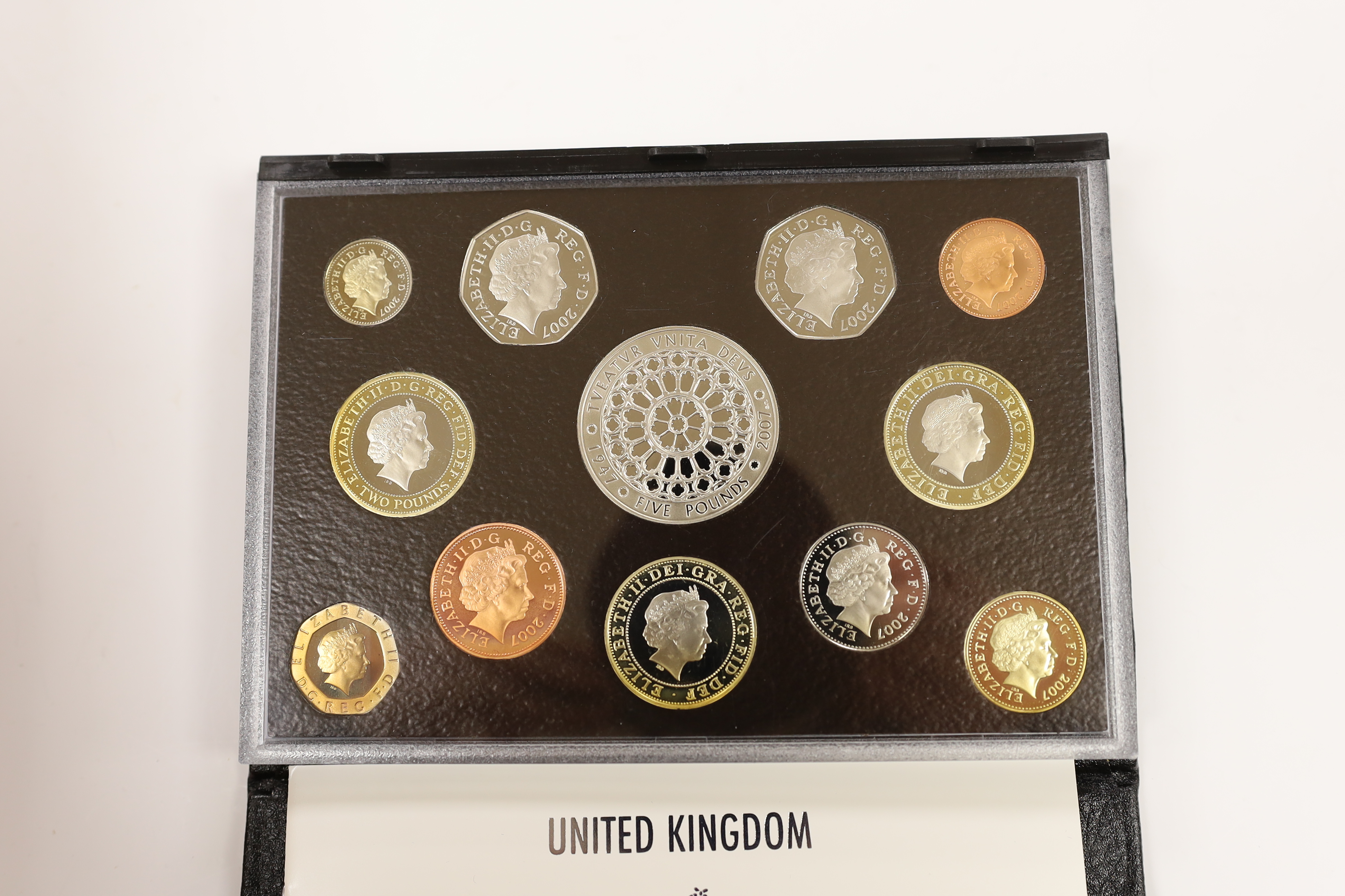 Royal Mint UK QEII proof coin year sets for 2002, 2003, 2005-2008, 2010, 2012 together with two Executive Collections for 2001 & 2004 and a Royal Shield Arms collection 2008, 11 cases